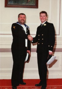 Geoff Oakey shaking hands with his brother Chief Petty Officer Stuart Oakey (Stuart is 10 years younger than Geoff)